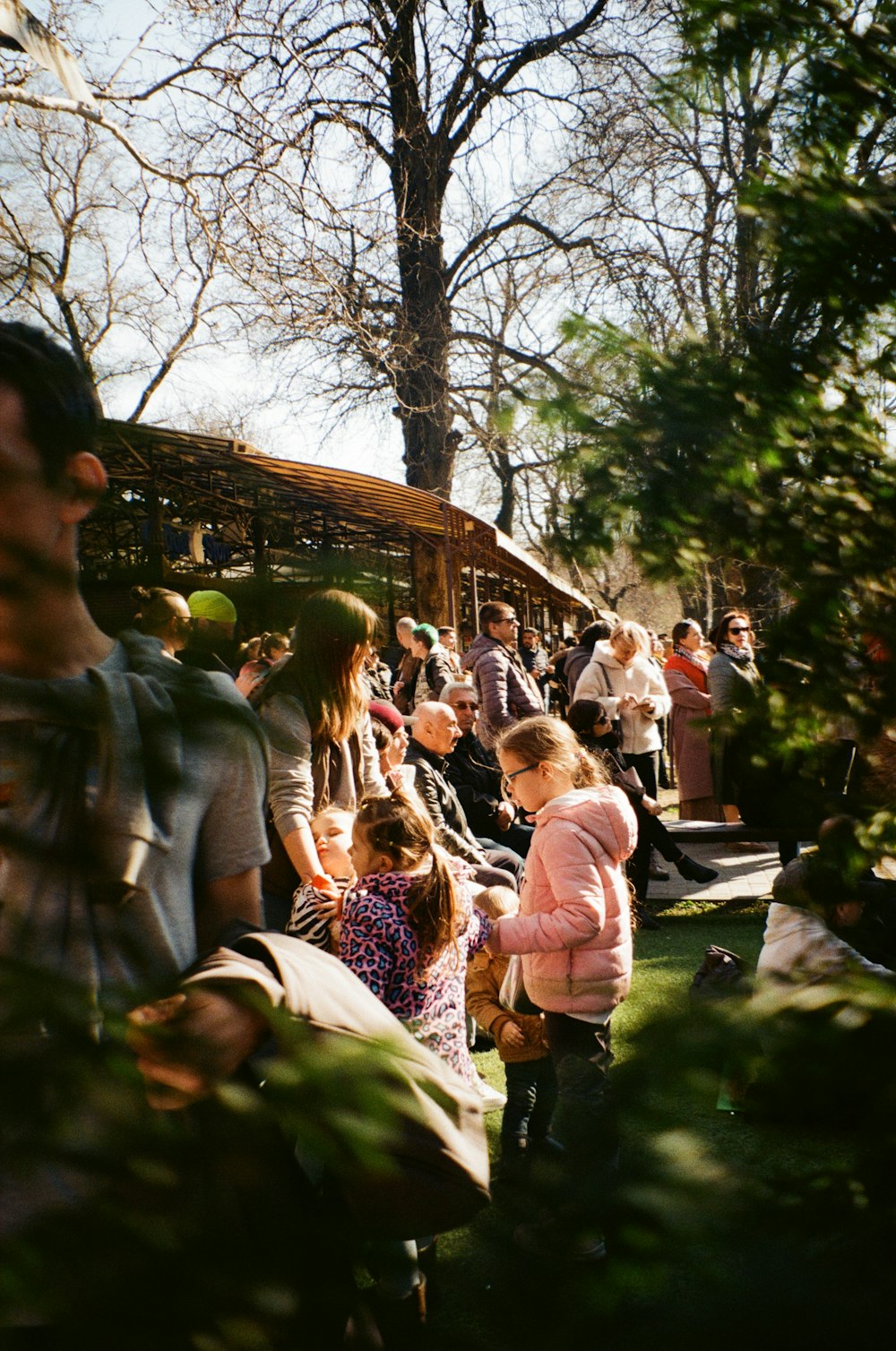 a group of people standing around each other