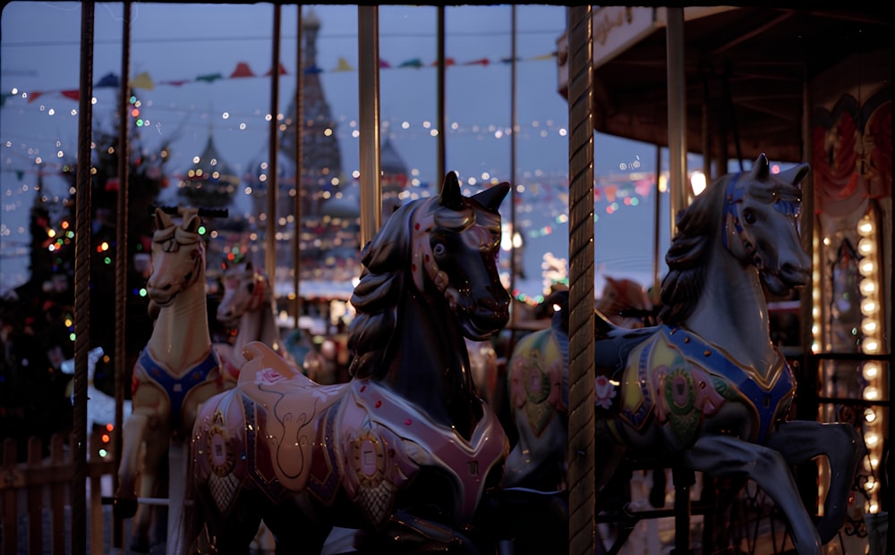 a merry go round at a carnival with lights