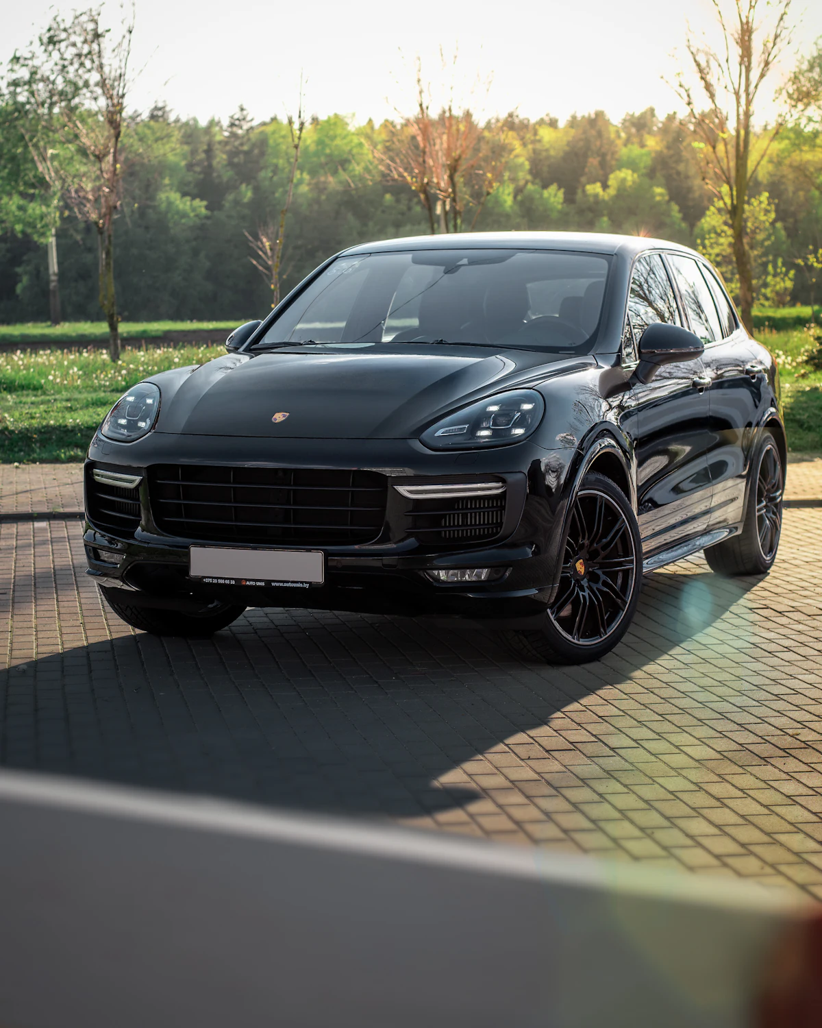 Black Porsche Cayenne on a driveway
