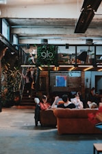 a group of people sitting around a living room