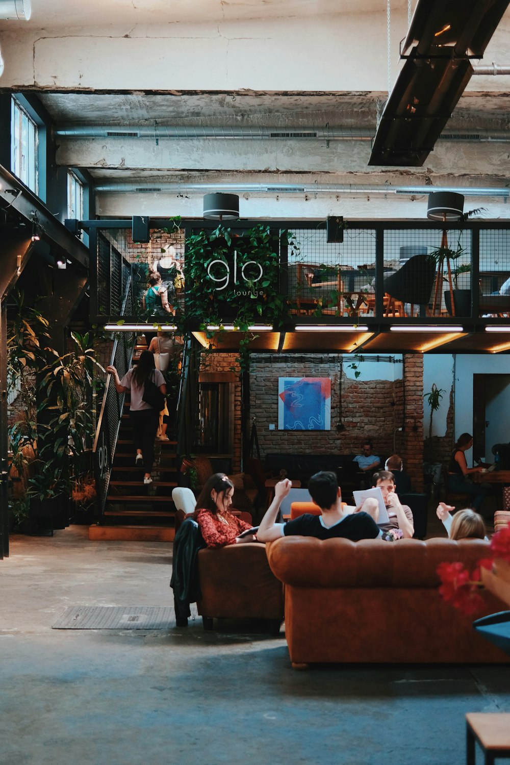 a group of people sitting around a living room