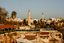 a view of a city with a clock tower in the background