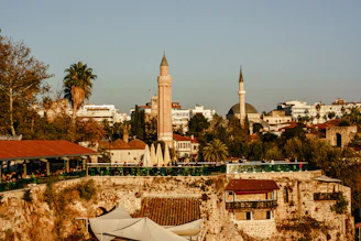 a view of a city with a clock tower in the background