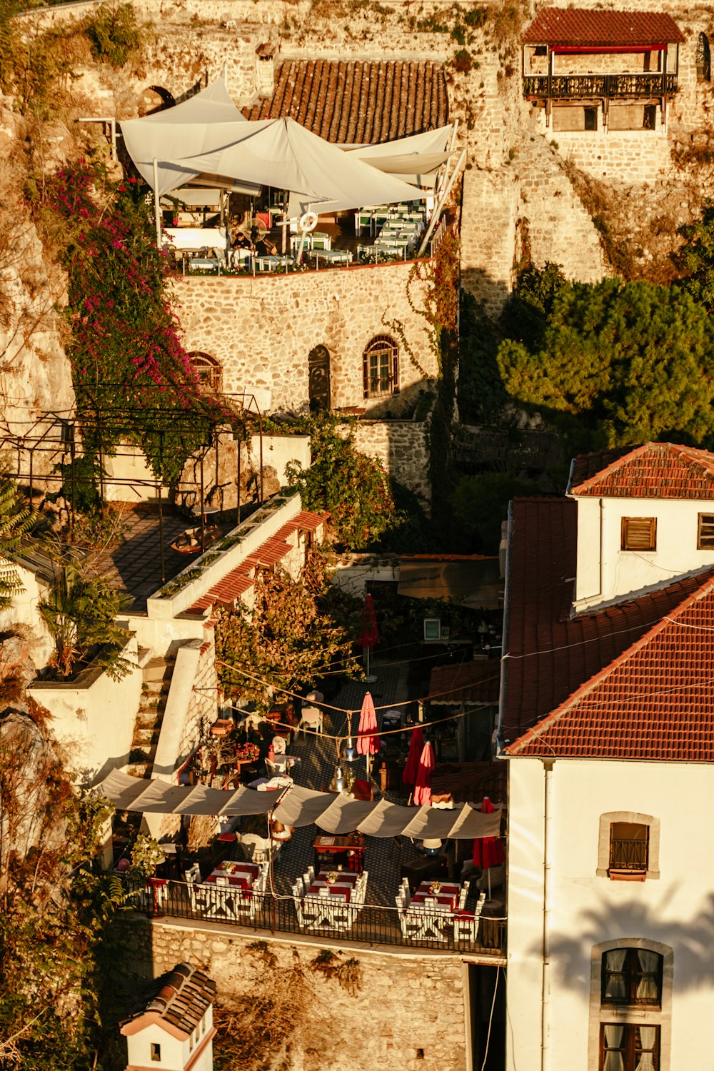 an aerial view of a restaurant with tables and umbrellas