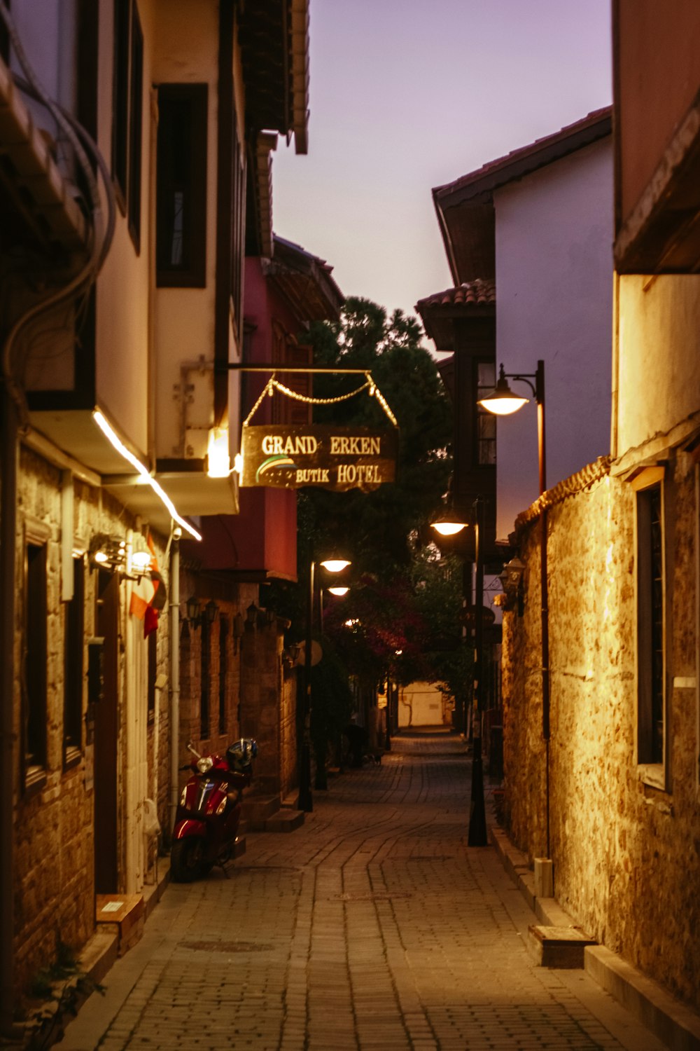 a street with a sign that says grand eric hotel