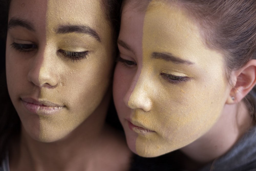 a couple of women standing next to each other