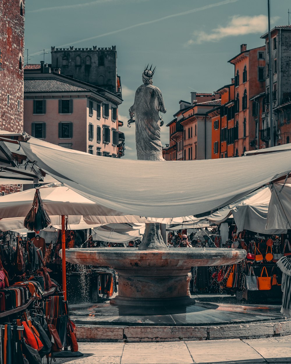 a statue is in the middle of a market