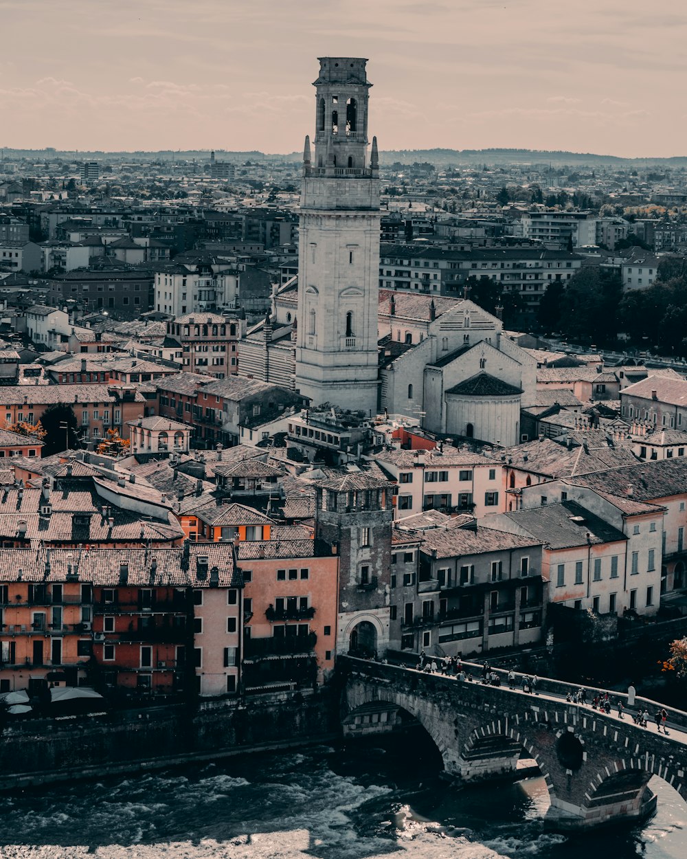 a view of a city with a bridge in the foreground