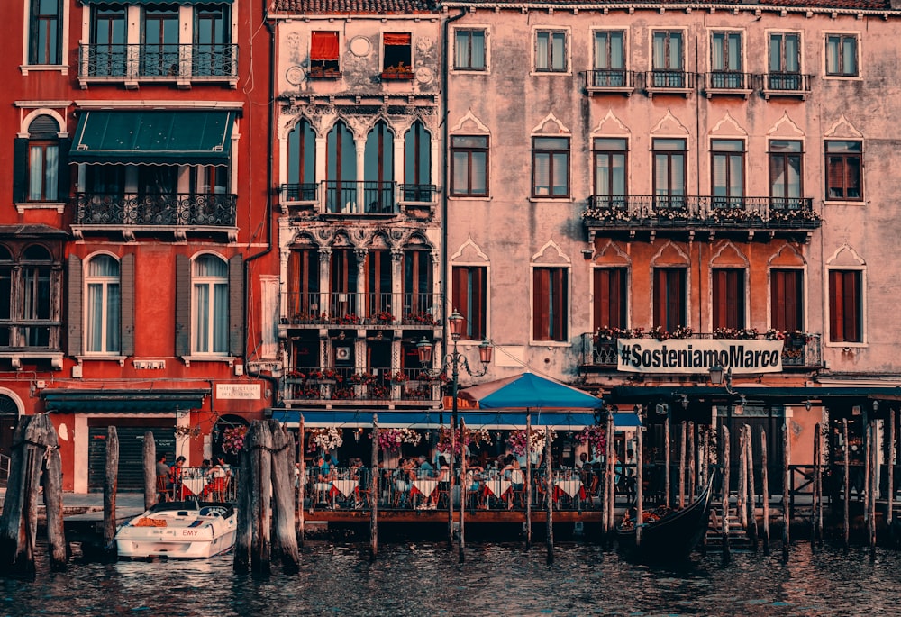 a row of buildings next to a body of water