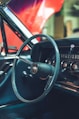 a car dashboard with a steering wheel and a dash board