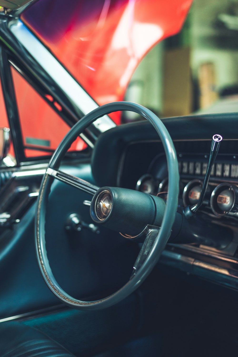 a car dashboard with a steering wheel and a dash board