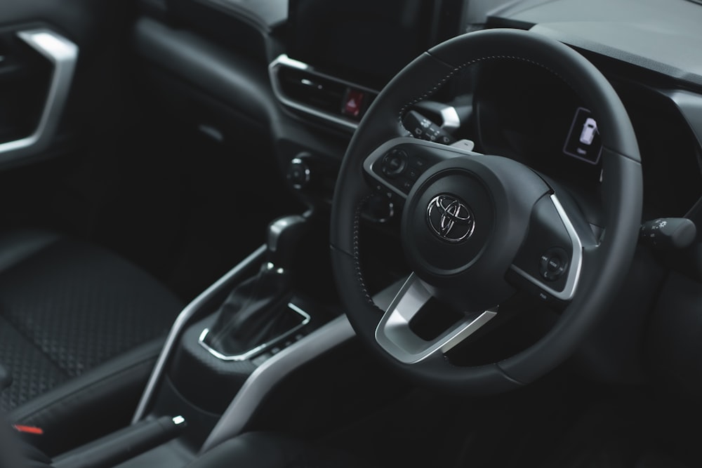 the interior of a car with a steering wheel