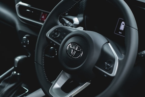 a close up of a steering wheel of a car