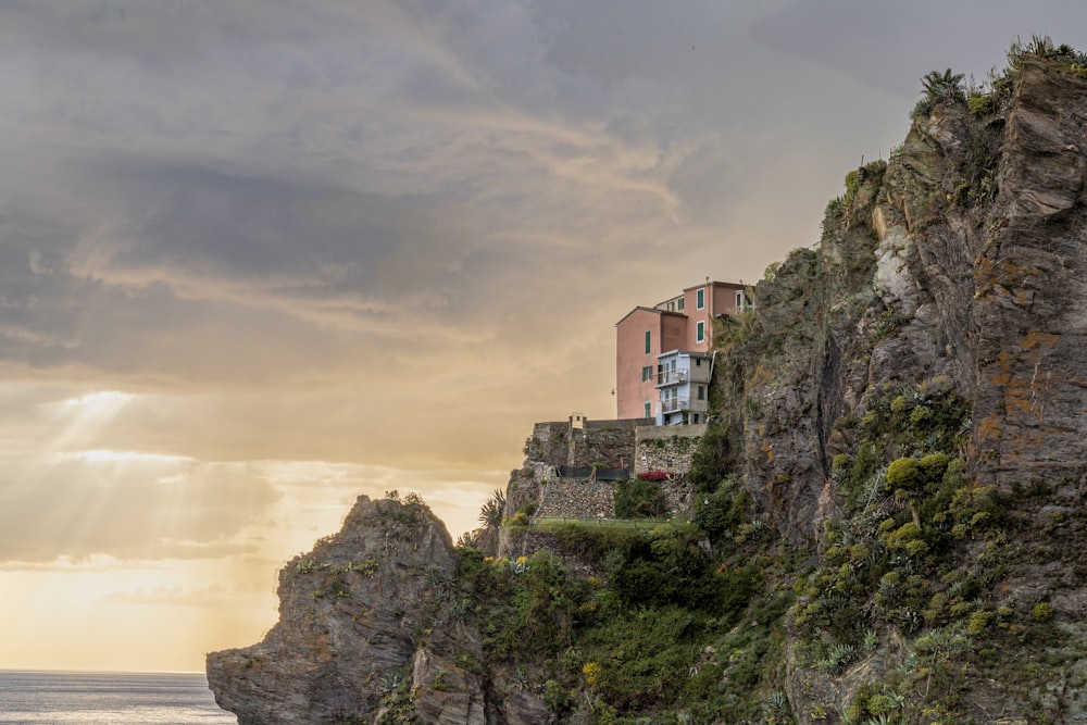 a house on a cliff overlooking the ocean