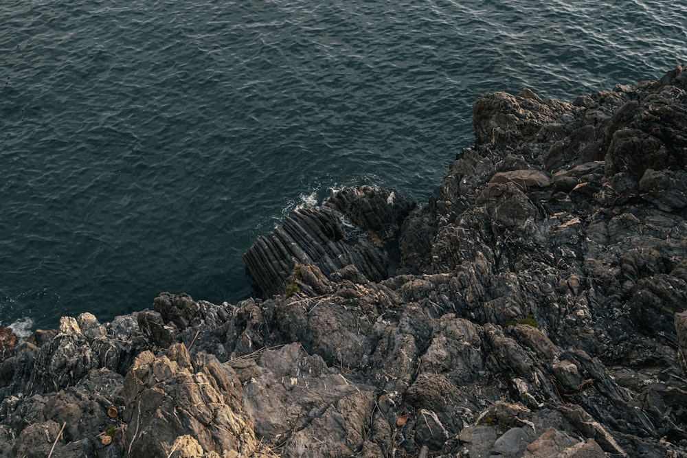 a view of the ocean from a rocky cliff