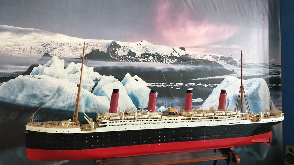 a model of a ship with icebergs in the background