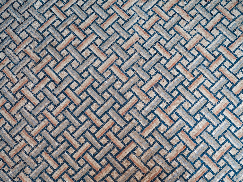 a close up of a blue and brown rug