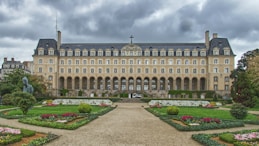 a large building with a garden in front of it