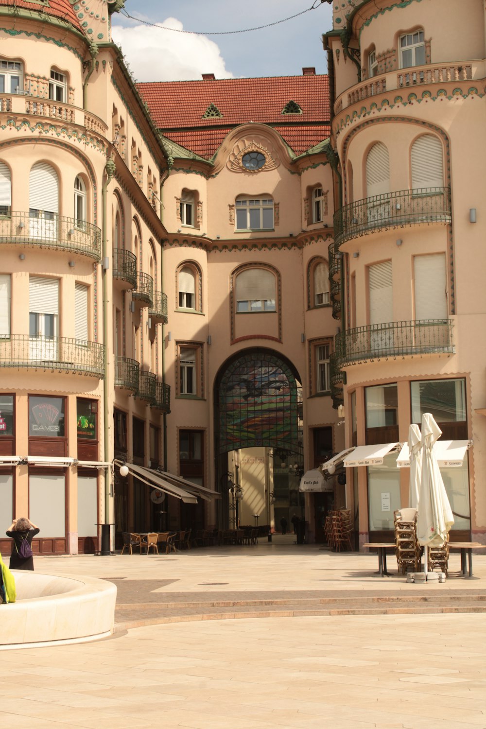 a large building with a fountain in front of it