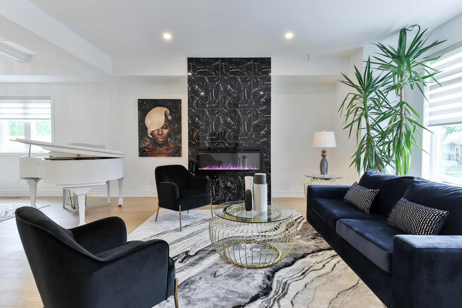 a living room filled with furniture and a piano