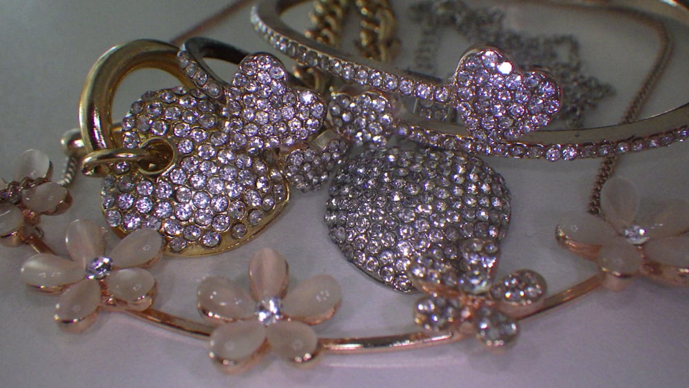 a close up of a bunch of jewelry on a table