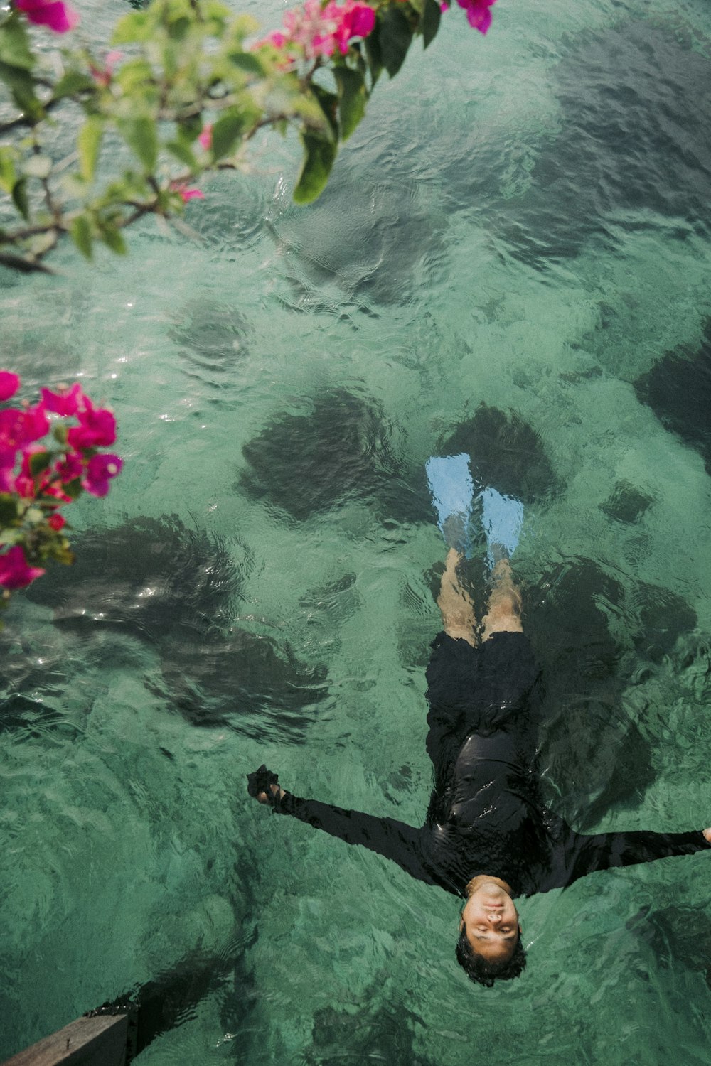 a person floating in a body of water