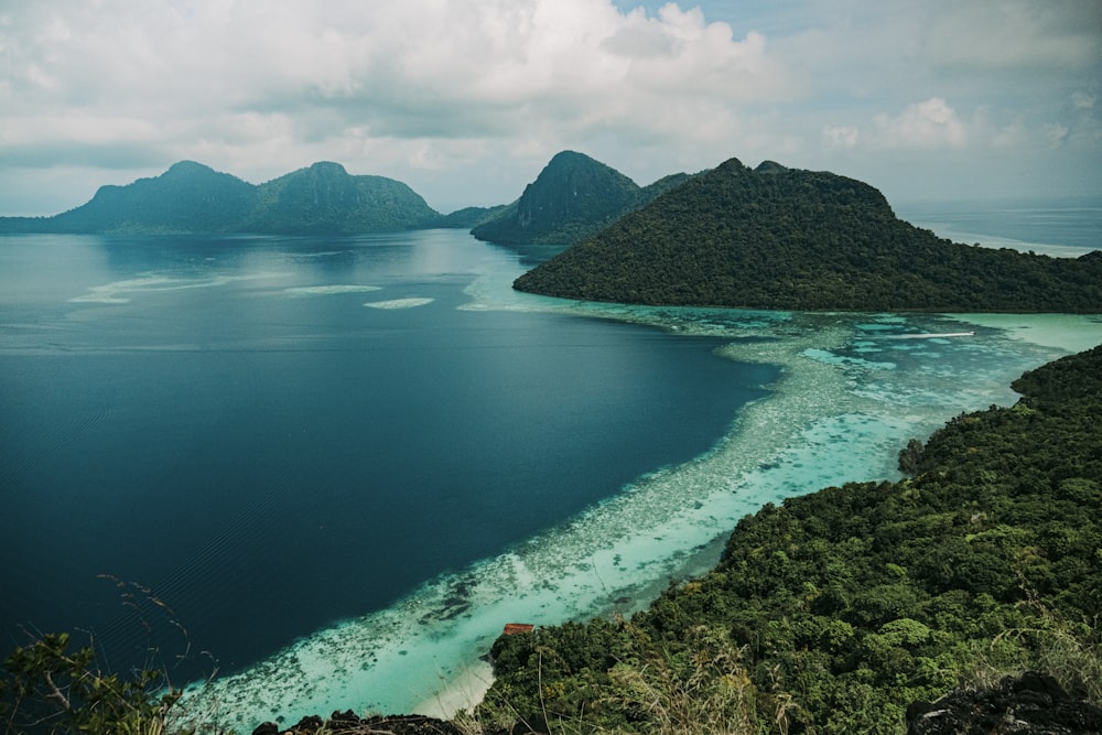 an aerial view of a tropical island in the middle of the ocean