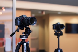 a tripod with a camera attached to it