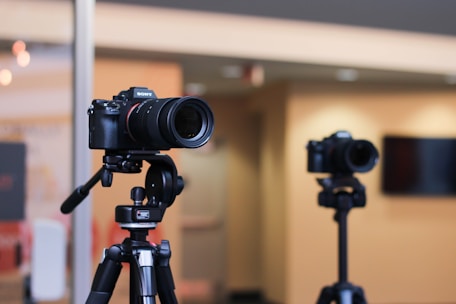 a tripod with a camera attached to it