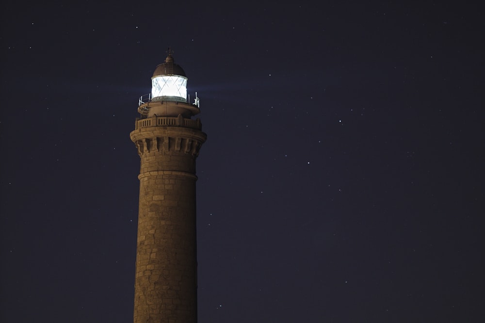 a tall tower with a light on top of it