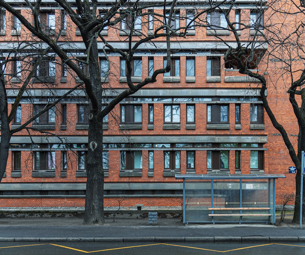 a tall brick building with a basketball hoop in front of it