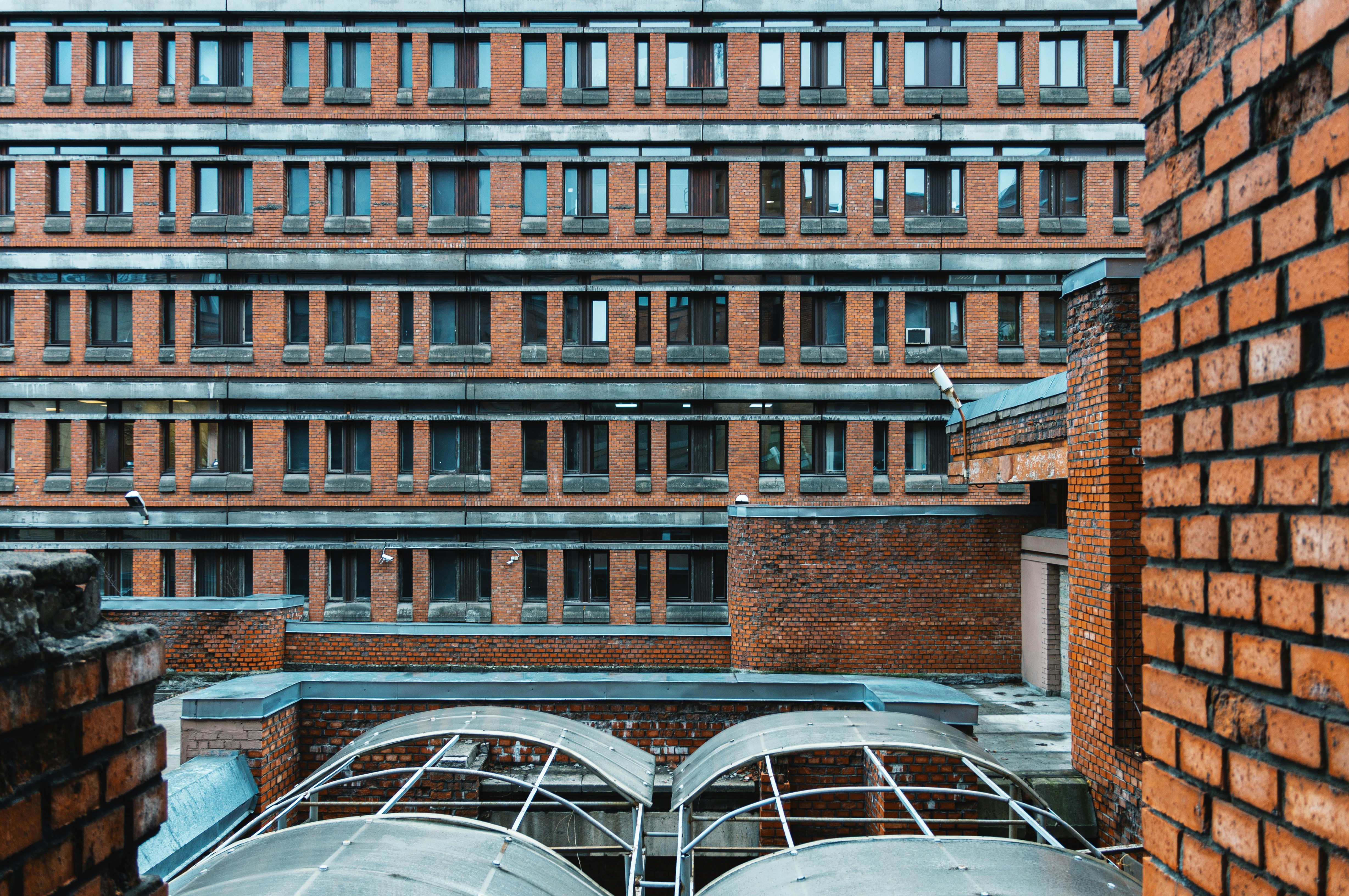 a view of a brick building from the top of a building