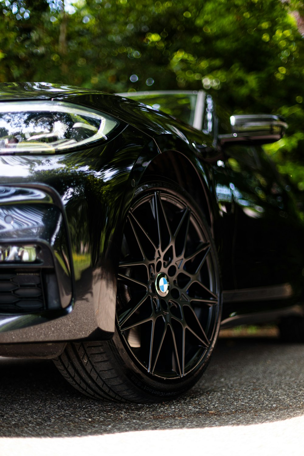 a black sports car parked on the side of the road