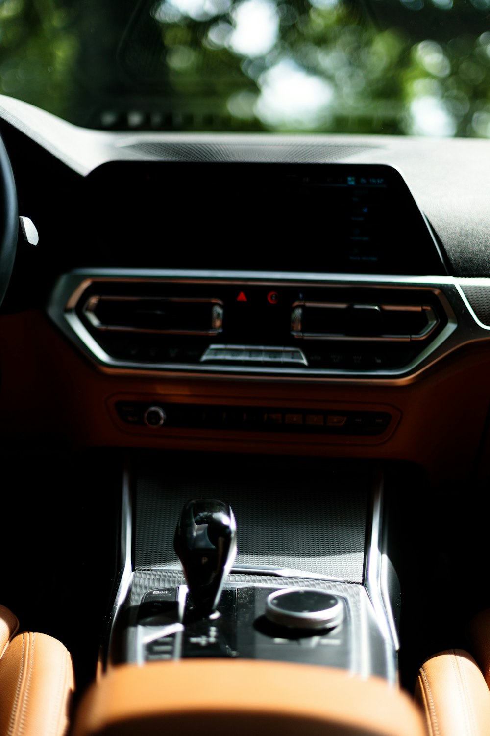 the interior of a car with a steering wheel and dashboard