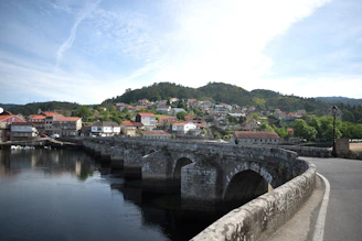 a stone bridge over a body of water