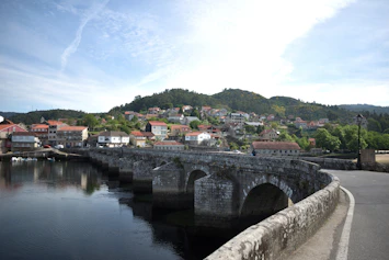 a stone bridge over a body of water
