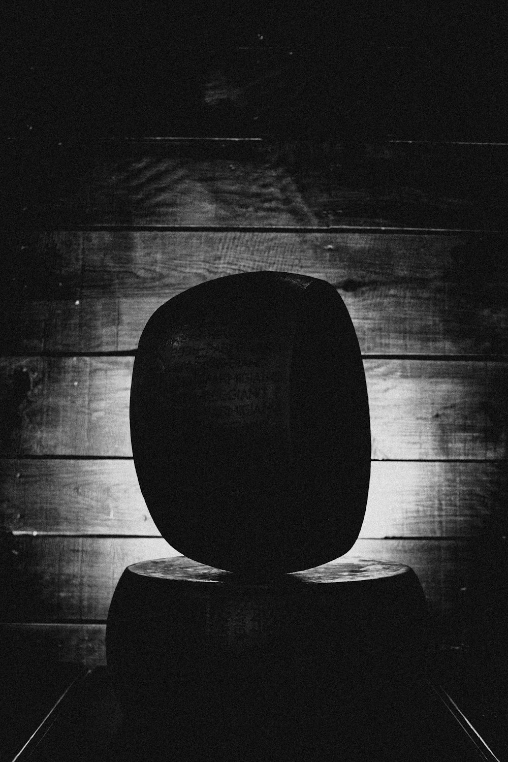 a black and white photo of a round object