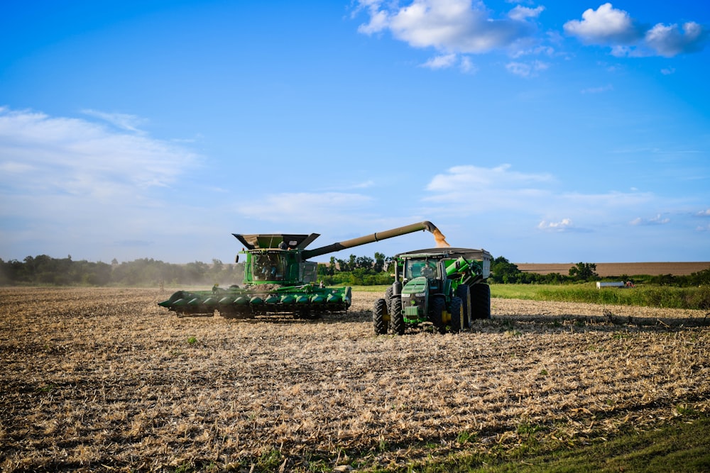 a tractor is driving in the middle of a field