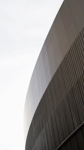 Close-up of a modern architectural detail featuring vertical lines and sharp edges, embodying precision.