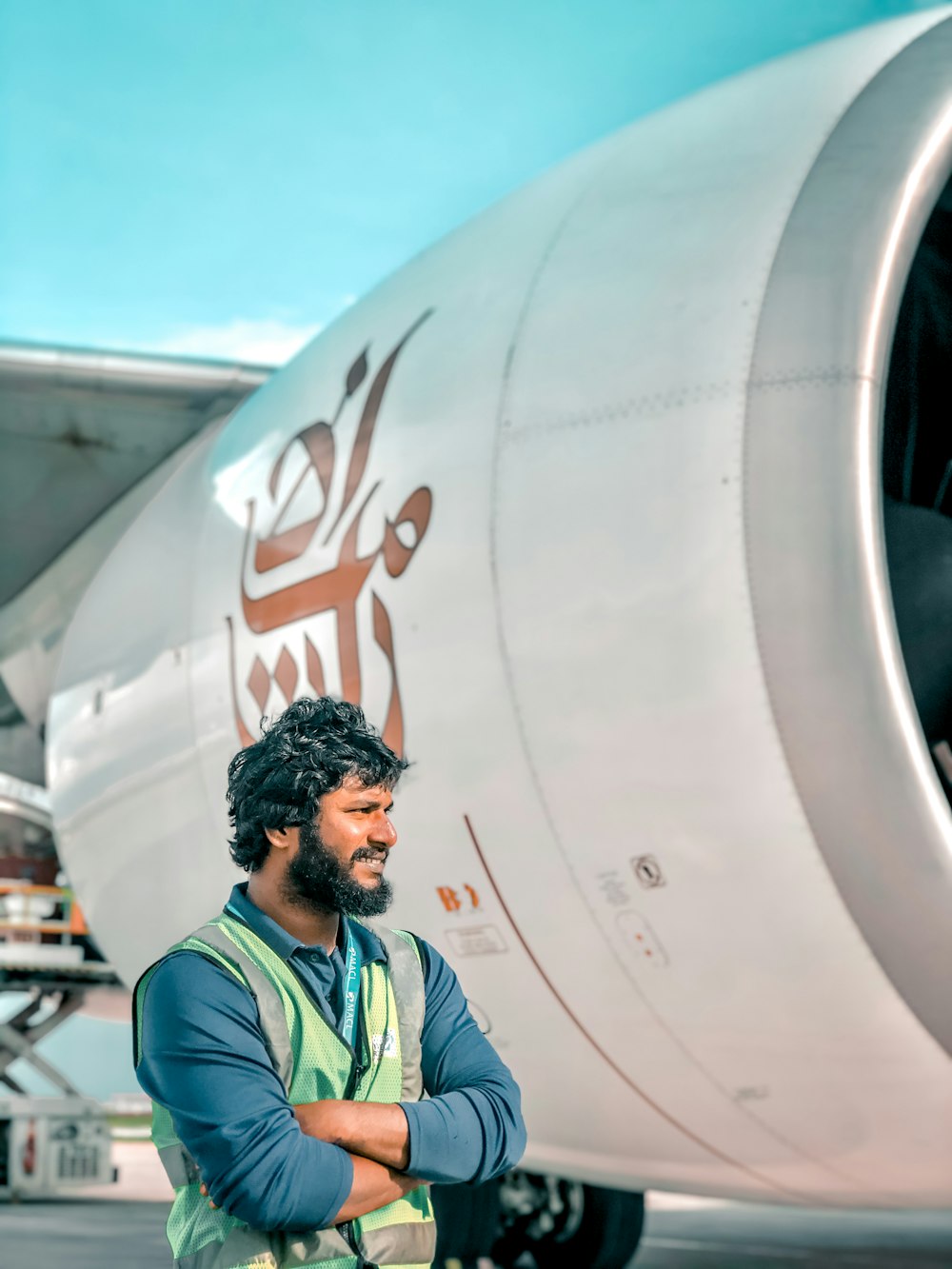 a man standing in front of a plane