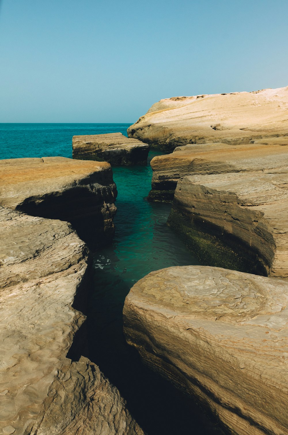 a body of water surrounded by large rocks