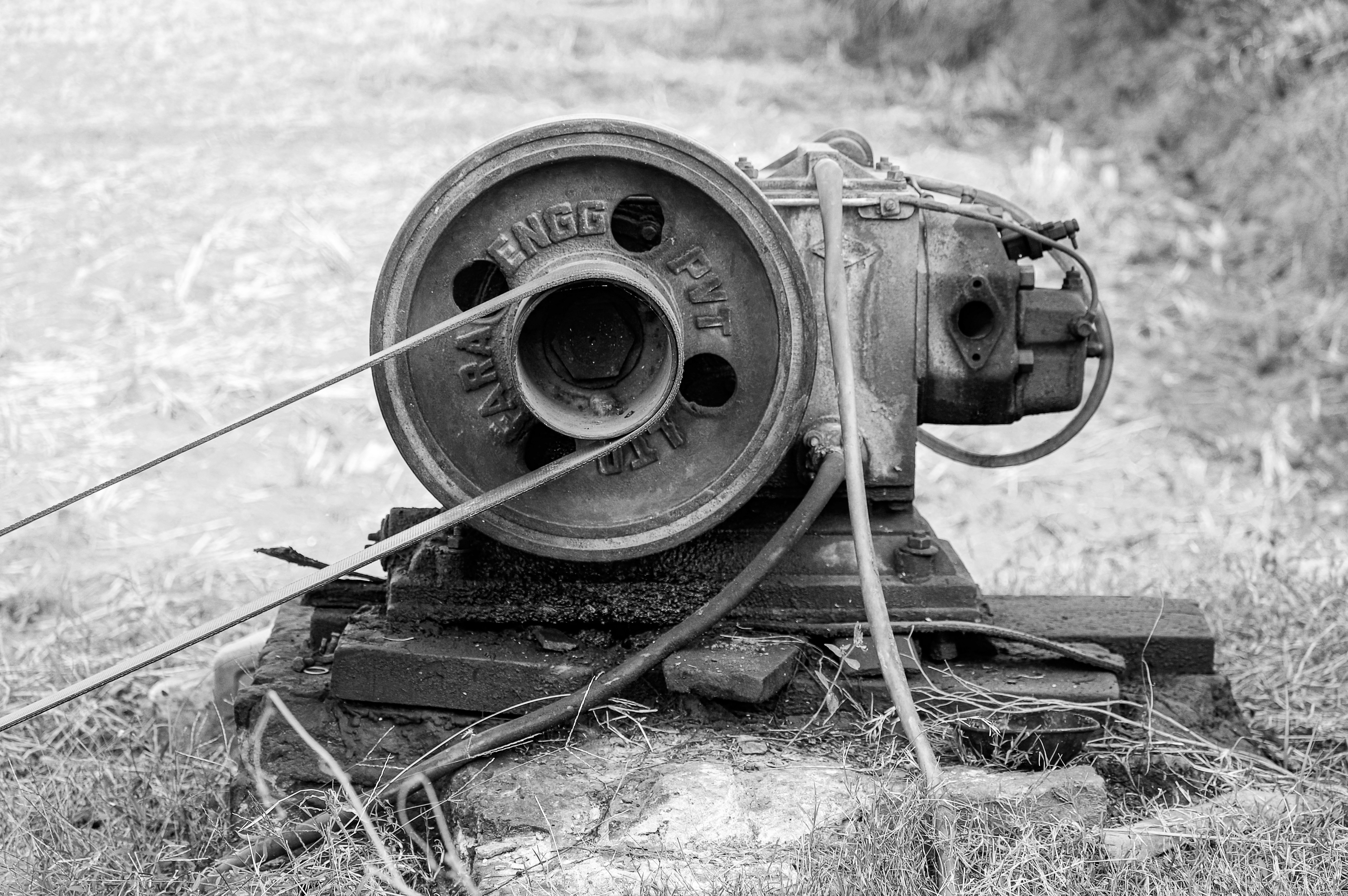 a black and white photo of an old movie projector