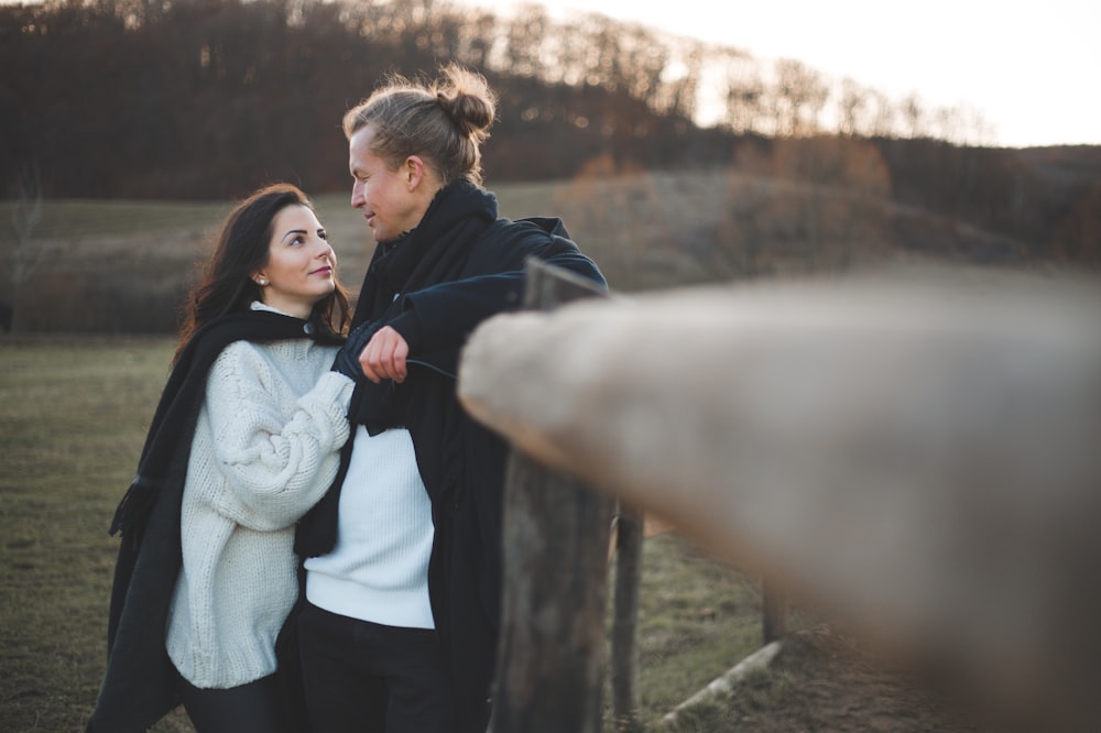 a man and a woman standing next to each other