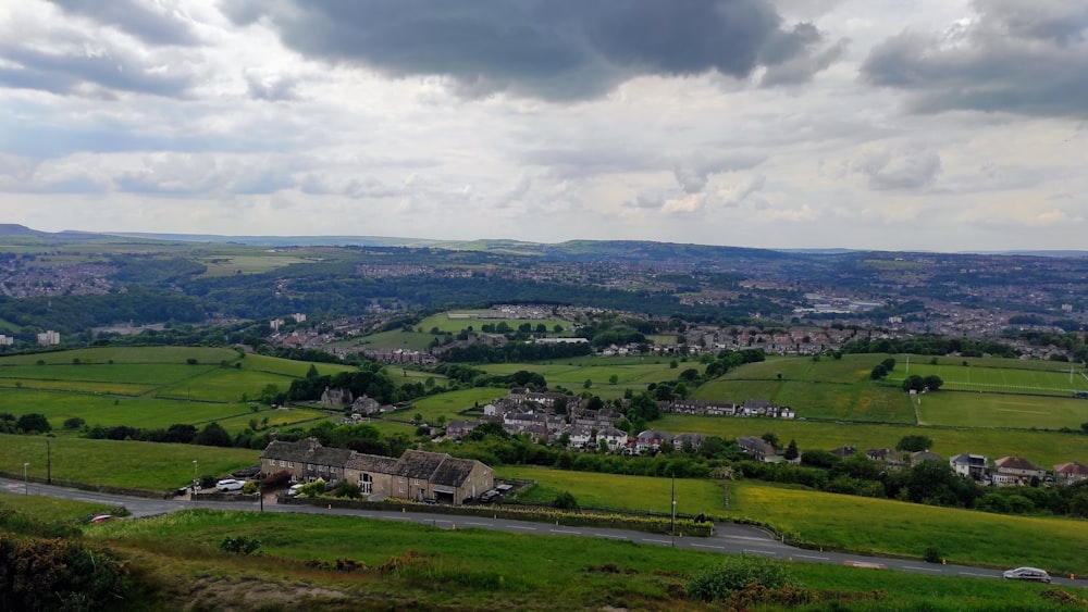 a scenic view of a rural countryside with houses