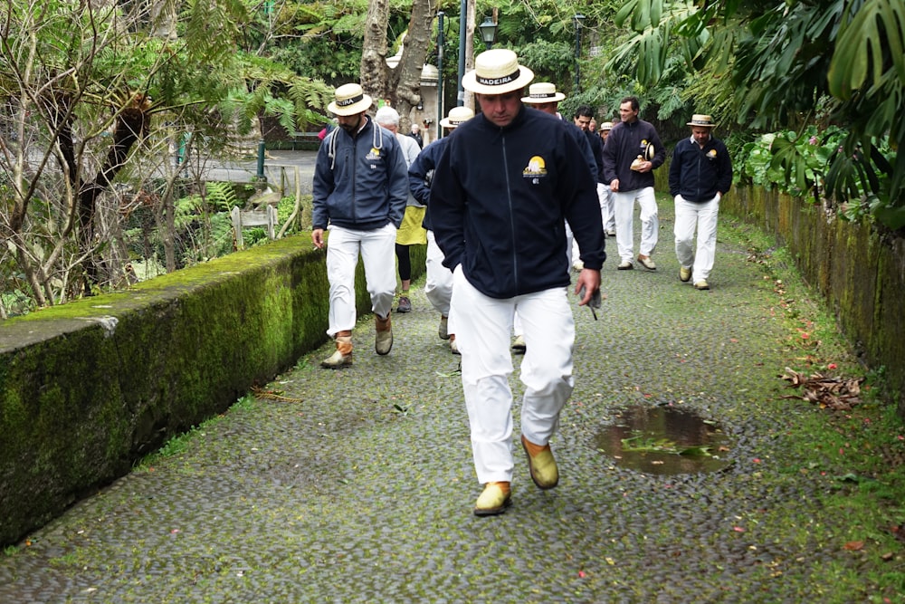 a group of men walking down a path