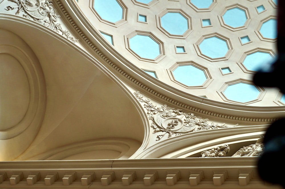 a close up of a ceiling with a skylight in the background