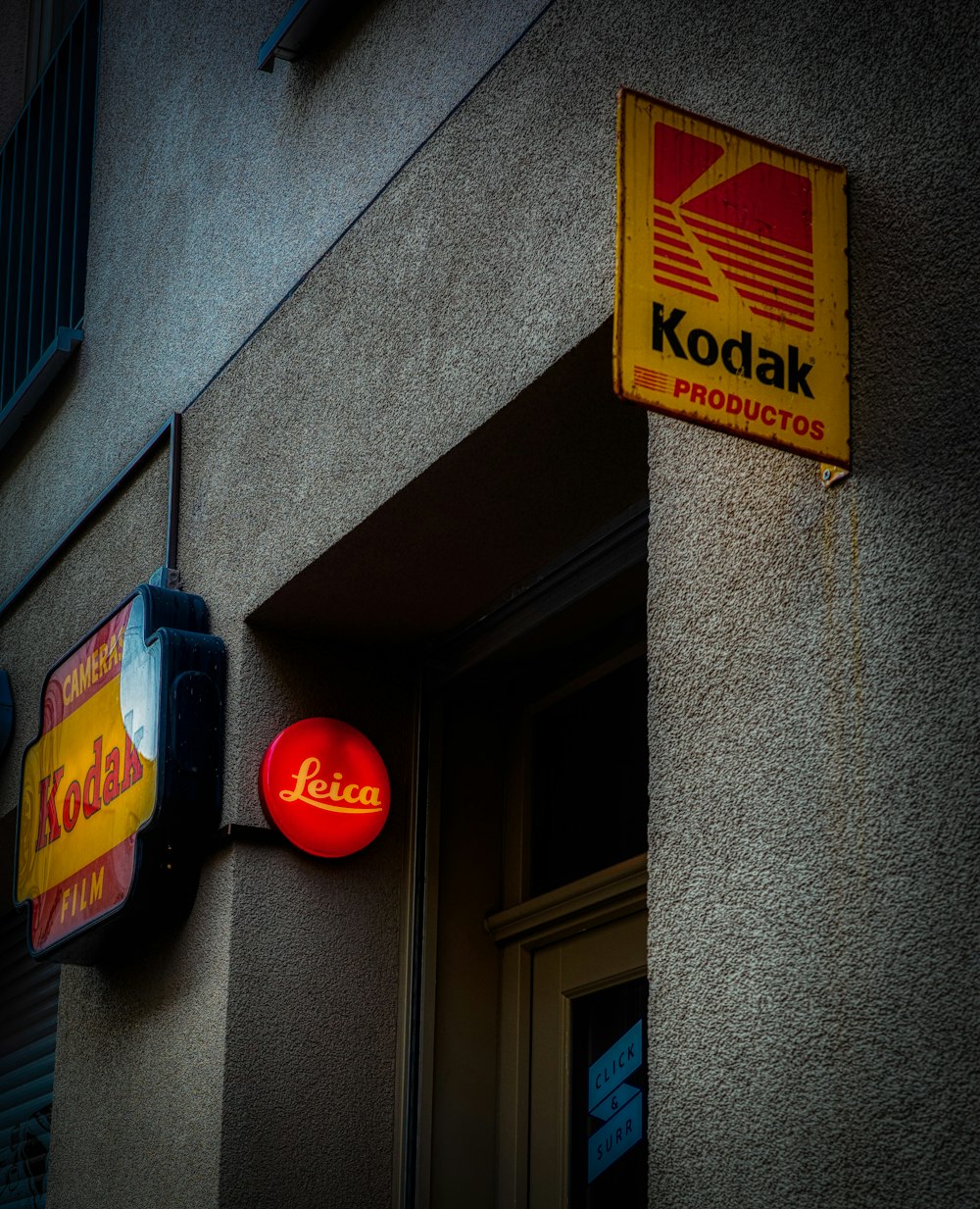 a kodak sign is hanging on the side of a building