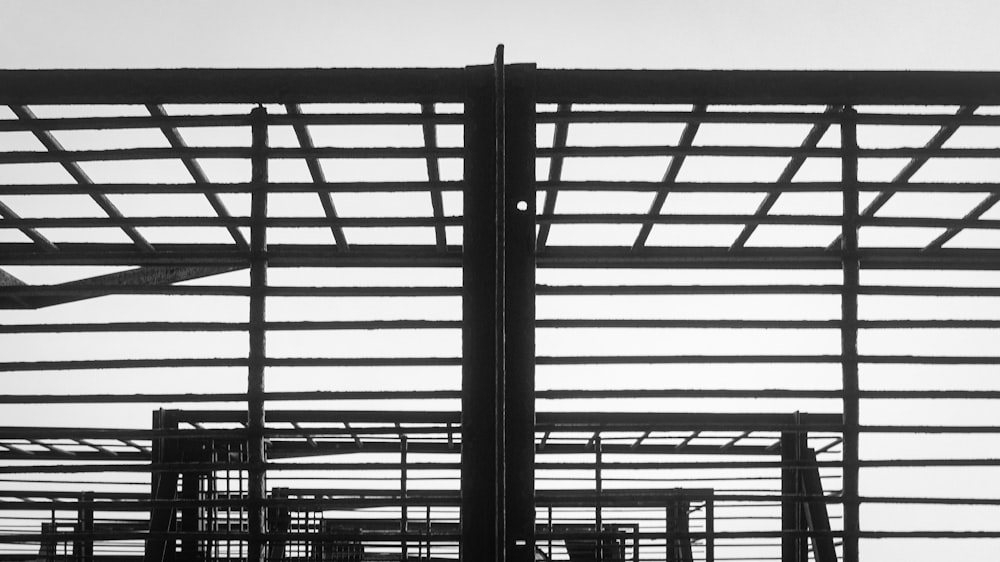 a black and white photo of a building under construction