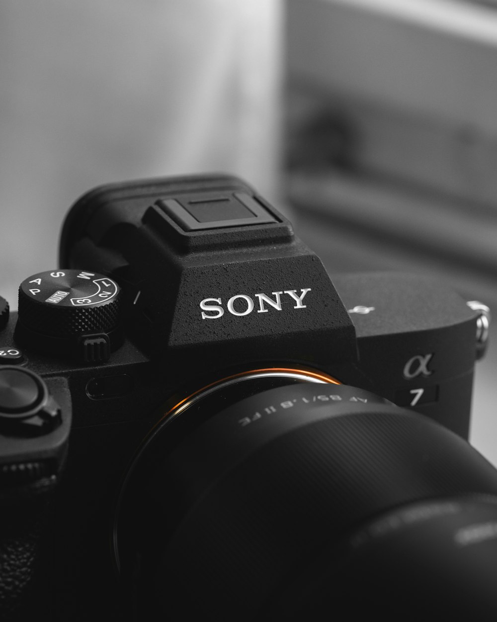 a black and white photo of a sony camera