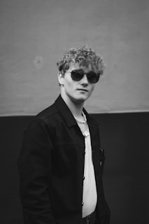 a man wearing sunglasses and a black shirt